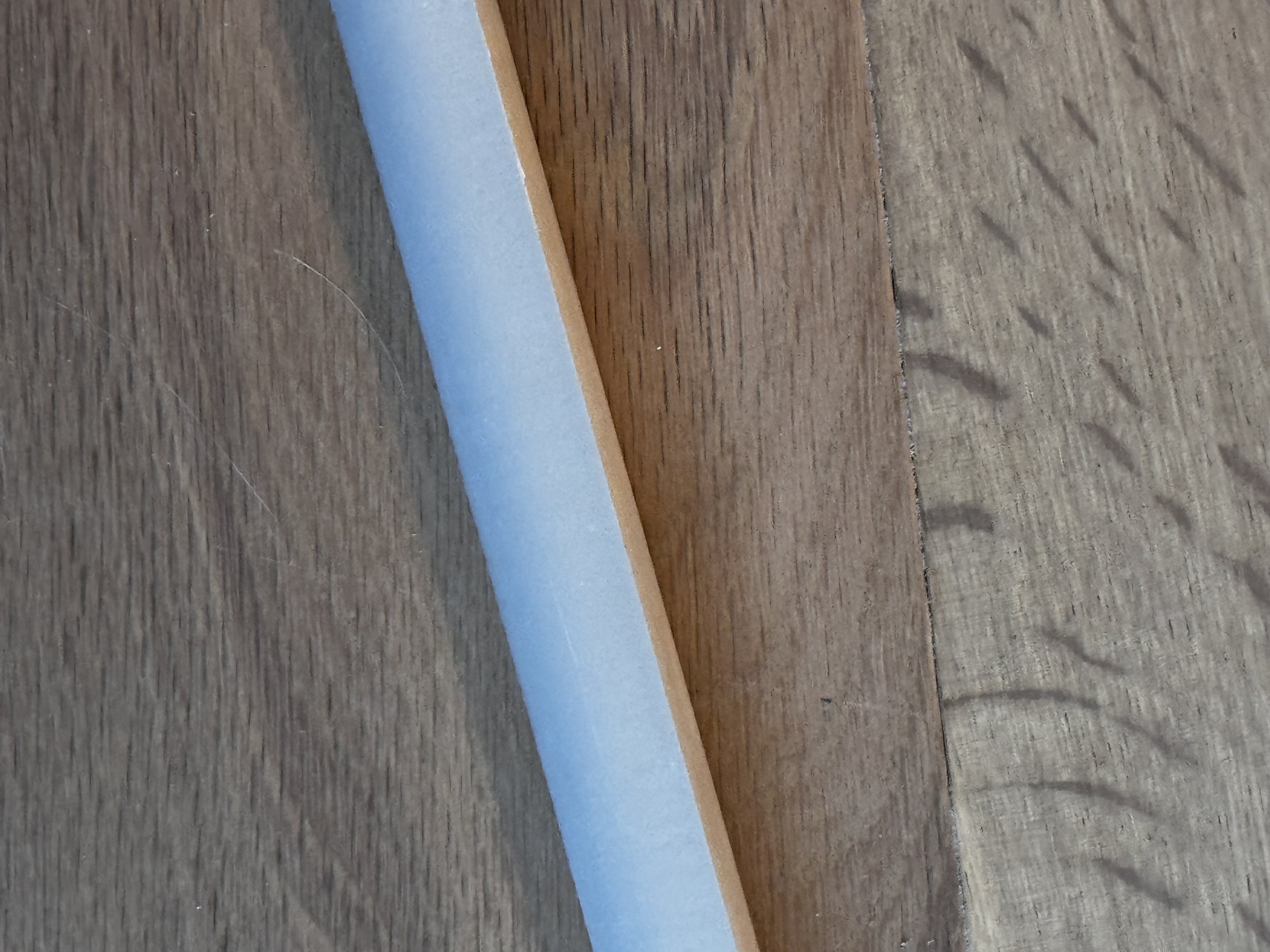 Piece of trim around the island under the kitchen sink